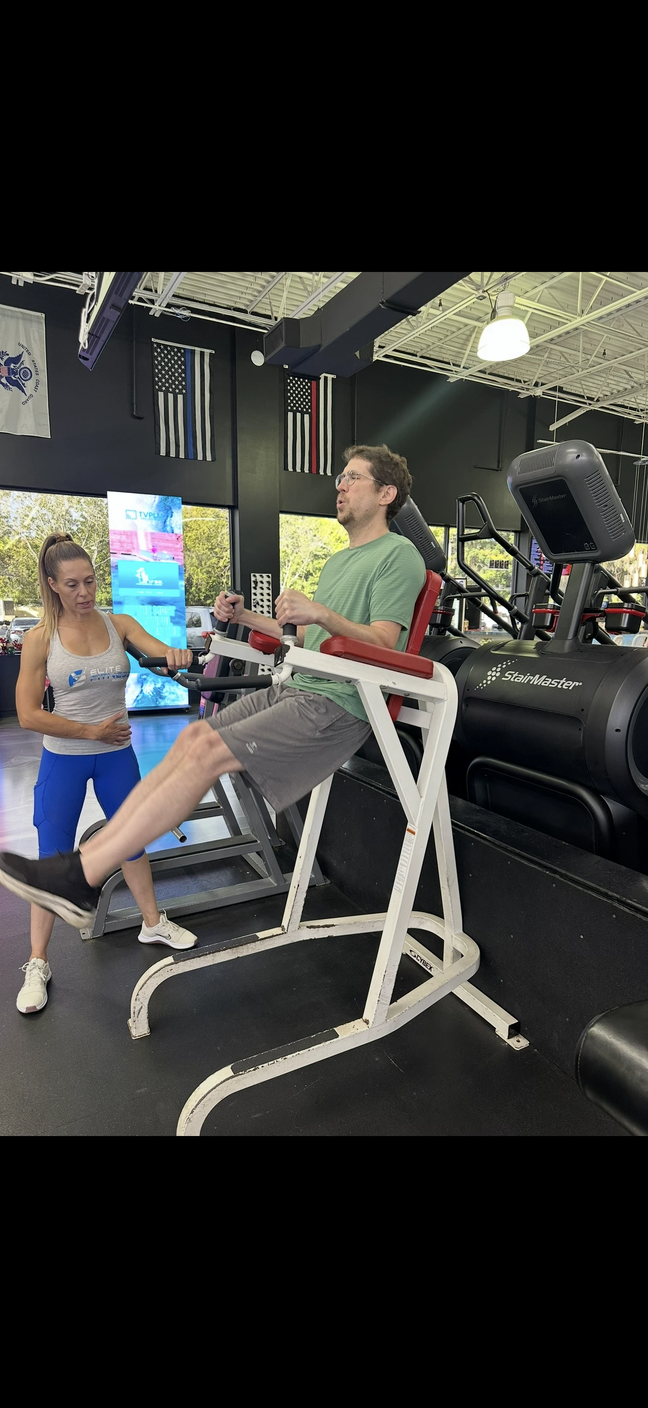 Diana Merhi guiding a client during a core exercise