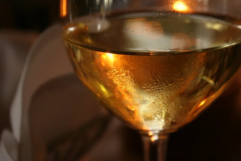 Glass of white wine on a table