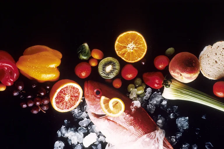 Fresh fruit, vegetables, bread, and fish for a balanced diet
