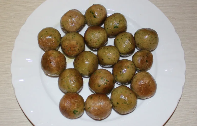 Vegetarian meatballs served on a white plate