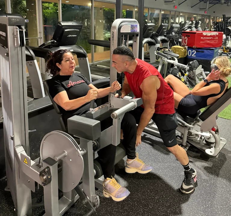 Elie coaching a client during a resistance training session