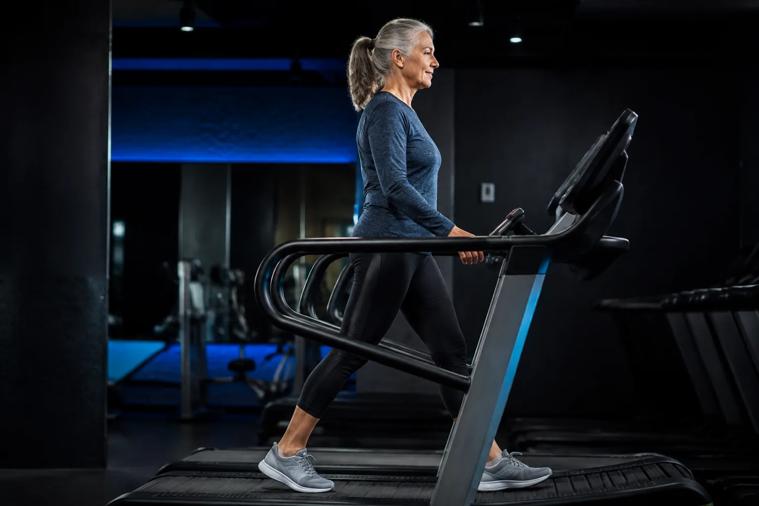 A woman walking on a treadmill